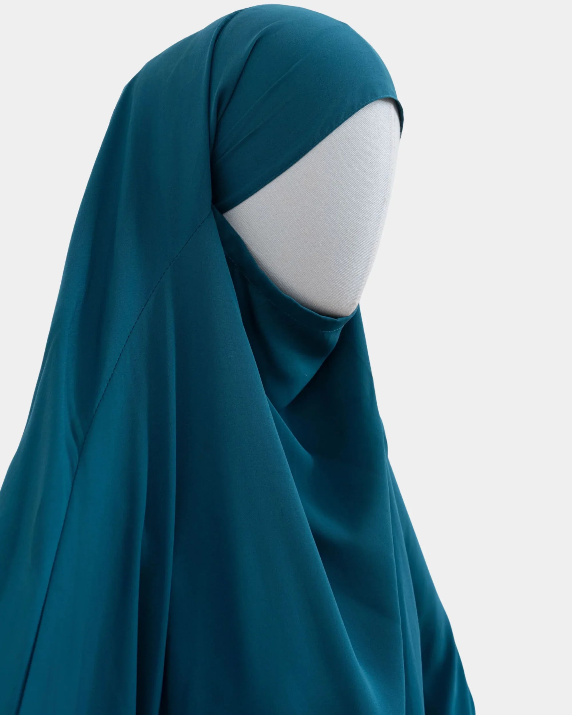 Jilbab 1 pièce bleu canard vu de profil, capuche couvrante et large tombé