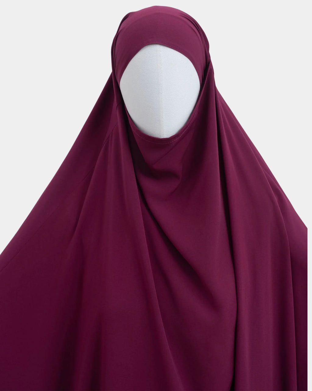 Capuche du jilbab fuchsia et drapé du tissu sur le buste