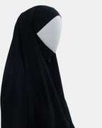 Jilbab 1 pièce noir vu de profil, capuche couvrante et large tombé