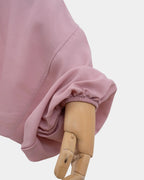 Manche du jilbab rose avec poignet élastiqué qui maintient la manche en place