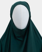 Capuche du jilbab vert forêt et drapé du tissu sur le buste