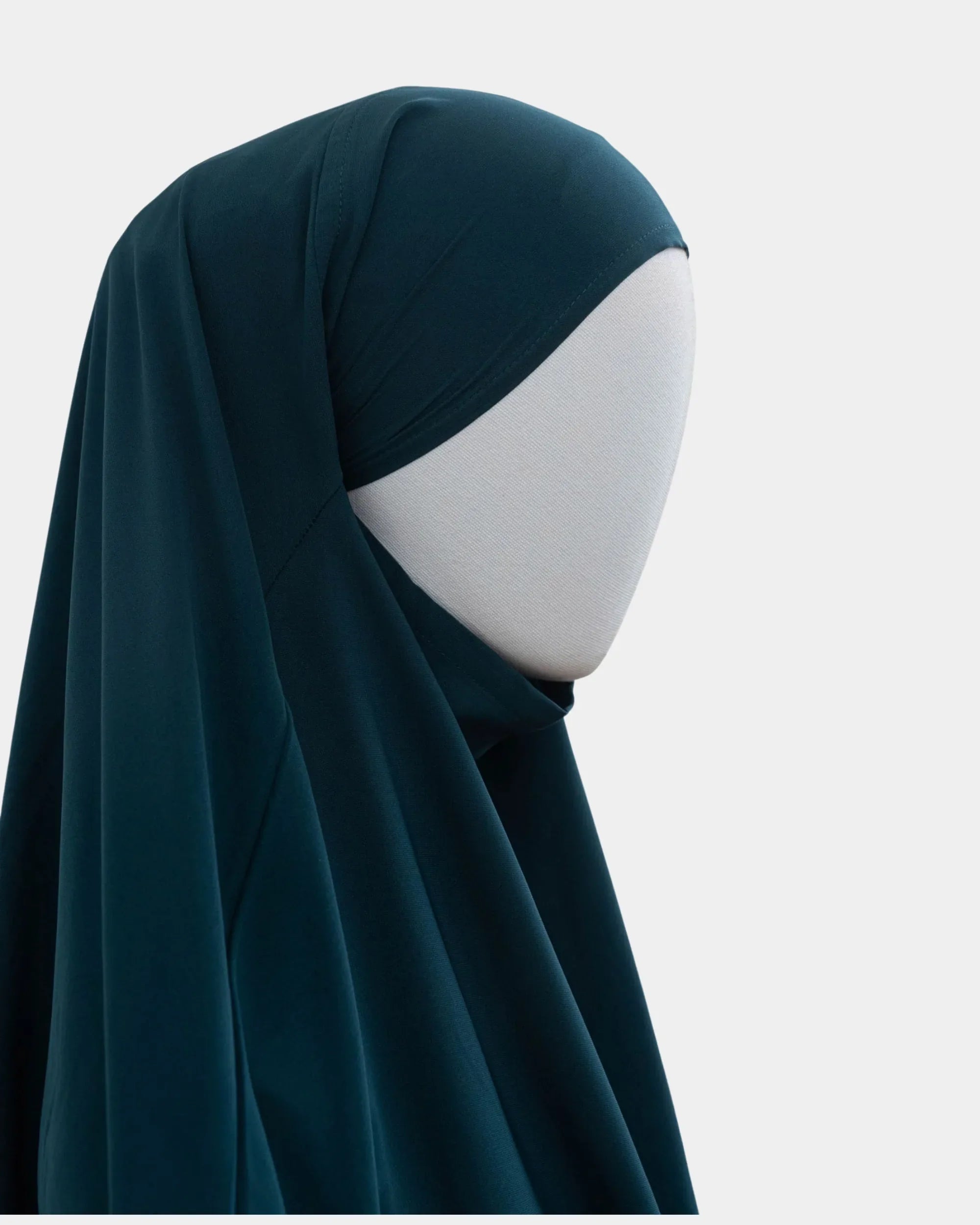 Capuche du jilbab 2 pièces bleu pétrole vue de profil, tombé couvrant sur l'épaule